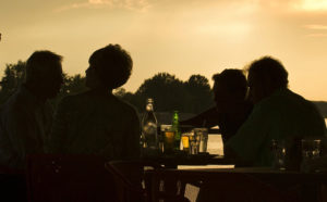 See how much a bit of eating and singing at sunset can make you feel rich...